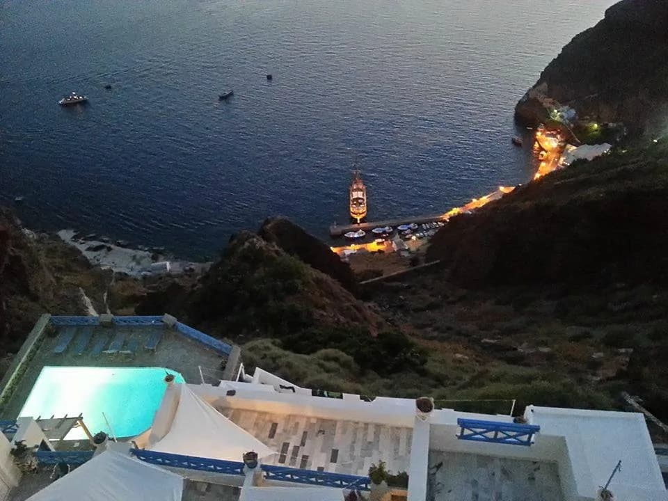The terraces at night, lit over the dark caldera